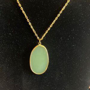 Handcrafted green glass pendant on 24 inch gold tone chain